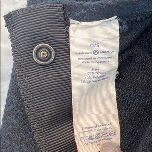 Lululemon Navy Shell with snap buttons. Can be worn variety of ways never used